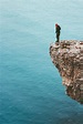 Traveler standing on cliff edge featuring outdoor, human, and hiking ...