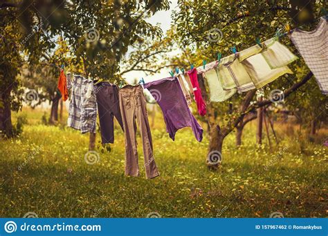 Hanging Laundry Color Clothes Hanging On A Clothesline Stock Photo