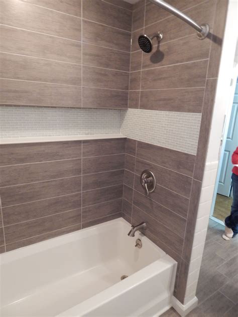 Lock them in place by cutting the tile around them. Custom tub and shower surround with with an integrated ...