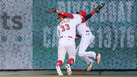 reds outfielders winker hamilton collide in memorable opening day catch