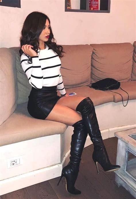 Sexy Legs In A Mini Skirt And Over The Knee Stiletto Boots Leather