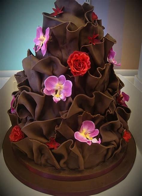 A rich chocolate cake topped with a smooth chocolate glaze, the dessert was named one of the most unique gifts of the year by bon appetit and nbc's today show. Chocolate Flower Cake | Chocolate wedding cake, Beautiful ...