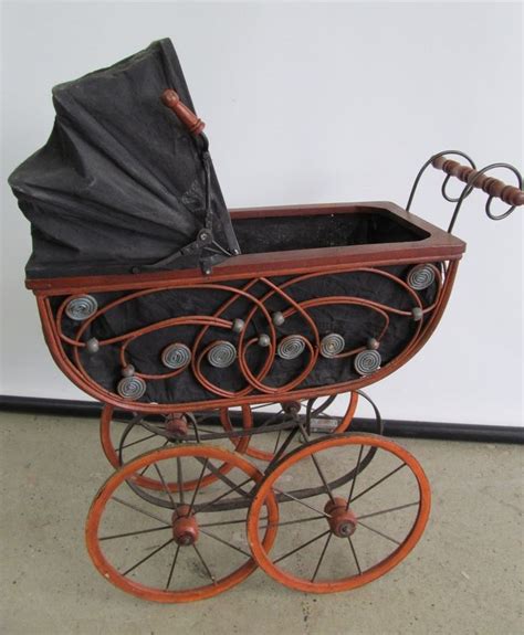 Antique baby carriage pram Wicker design wood with wood wheels and fabric top Коляски