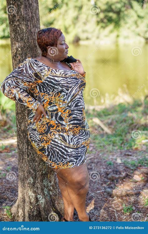 Big Black Beautiful Bbw Model Posing Outdors In An Animal Print Dress