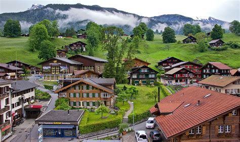 Grindelwald Switzerland Houses Mountains Fields Trees Hd