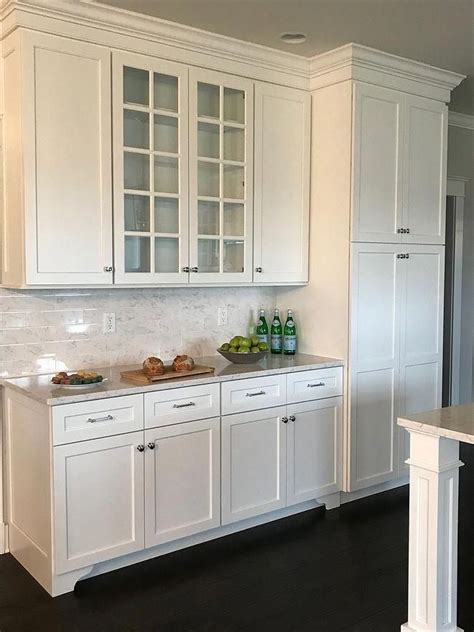 My favorite thing to pair with white paint is beautiful wood. Shaker style Kitchen cabinet paint color Sherwin Williams Extra White #kitchencabine… | Shaker ...