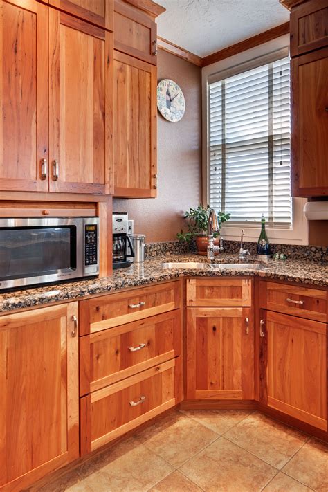 Kitchens with cherry wood cabinets offer a warm and luxurious look and match well with a variety of different countertop materials and finishes. Crown Cabinets Clearcreek Knotty Cherry Natural | Crown ...