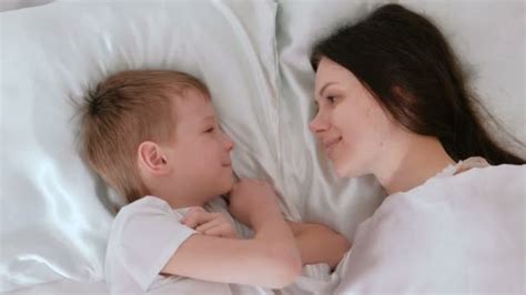 Mom And Son Wake Up Mom Kisses And Hugs Her Son Video By Familylifestyle Stock Footage