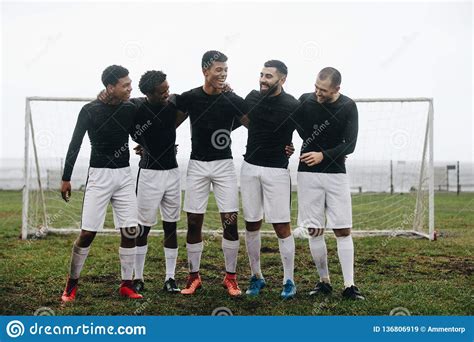 Group Of Soccer Players Standing Near The Goalpost Stock Image Image Of Sport Embrace 136806919