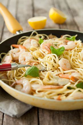 The universal appeal of shrimp scampi, frankly, isn't the shrimp but the pan sauce: Artichoke Rice Salad with Shrimp | Paula Deen