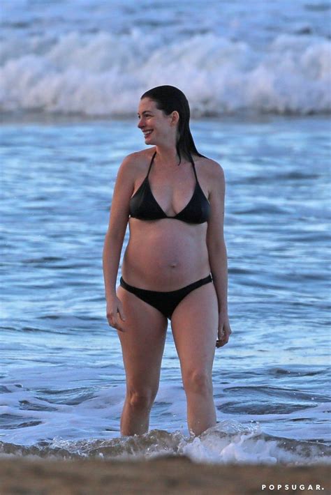 Anne Hathaway Shows Off Her Baby Bump During A Sunset Swim Anne