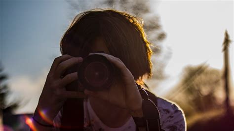 Focus Photography Of Woman Using Dslr Camera · Free Stock Photo