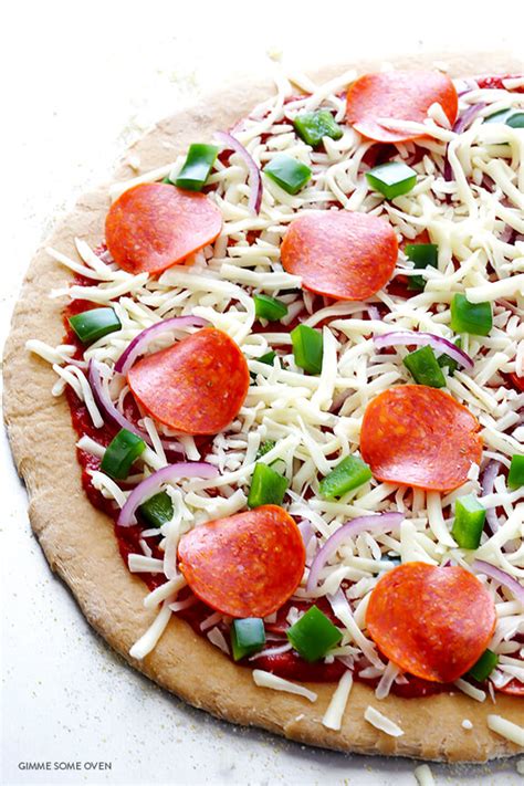 This quick whole wheat pizza dough recipe yields a crust of medium thickness. Whole Wheat Pizza Dough | Gimme Some Oven