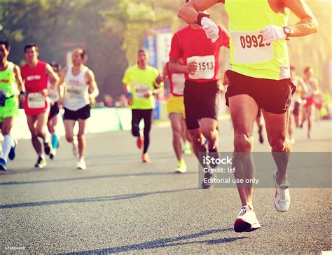Marathon Running Race People Feet On City Road Stock Photo Download