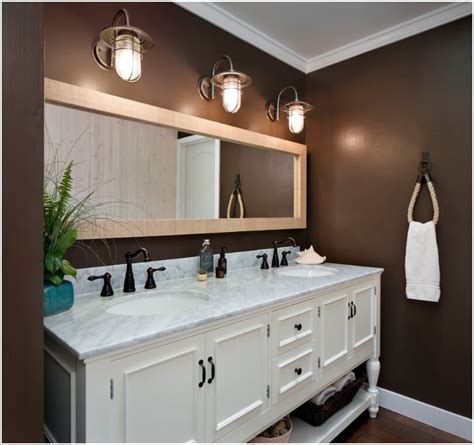 Recessed ceiling lights illuminate the entire space. 10 Chic Bathroom Vanity Lighting Ideas