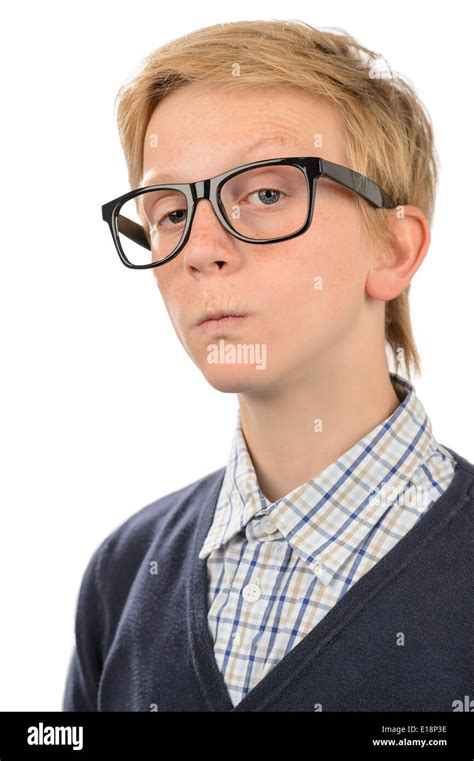Serious Teenage Nerd Boy Wearing Geek Glasses Against White Background