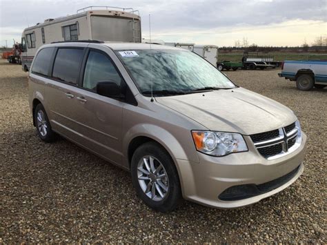 Автомобиль без вложений, на машине не езжу стоит на паркинге. 2014 DODGE CARAVAN MINIVAN - Weaver Bros. Auctions Ltd.