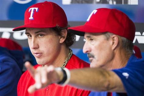 Texas Rangers Starting Pitcher Derek Holland Talks With Pitching Coach
