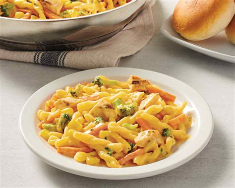 Stir in diced pimientos and sprinkle cheese over chicken and vegetables. Cheesy Chicken Skillet Meal