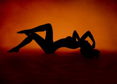 Woman Sexy Silhouette Lying At Red Orange Background