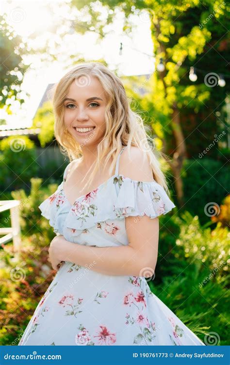 Beautiful Blonde Girl In Summer Dress Walking In Garden In Backyard Stock Image Image Of