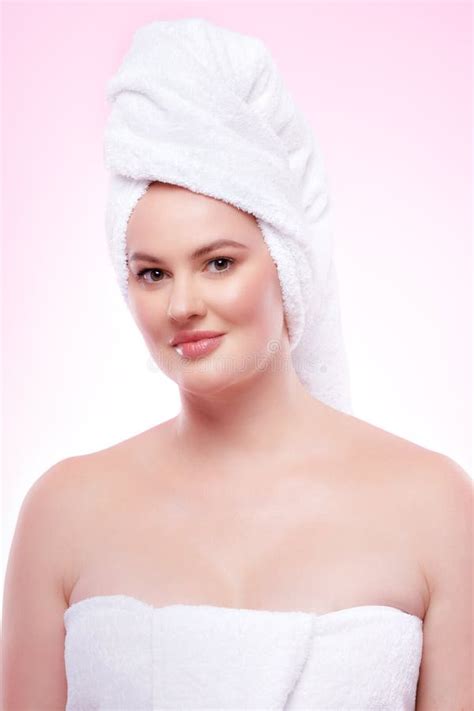 Beautiful Woman Wrapped In Towels After Spa Treatment On Pink