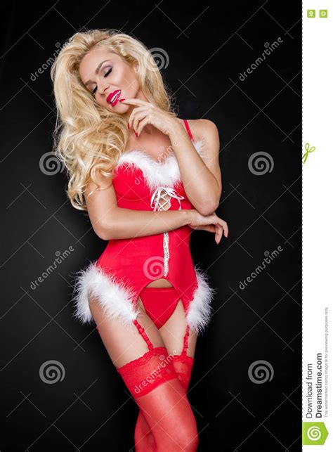 Beautiful Blonde Female Model Snowflake Dressed As Santa Claus Erotic Red Lingerie Stock Image
