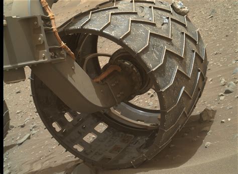 The mars 2020 perseverance rover wheels and legs. Rock stuck in one of the Curiosity rover's wheels : space