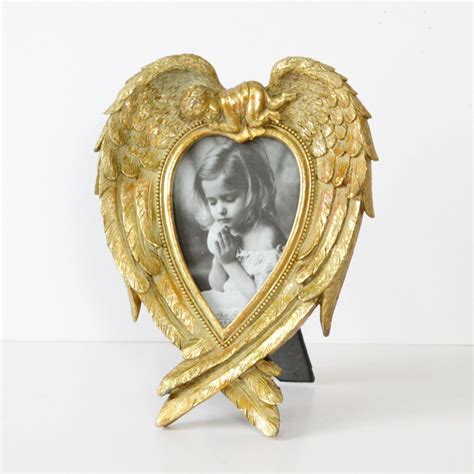 Heart-Shaped Angel Wings Frame | Heart shaped angel wings, Heart shaped angel, Gift shop interiors