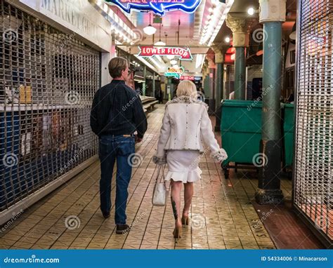 Couple Strolls Through Public Market At Night Editorial Photo Image Of Woman Couple