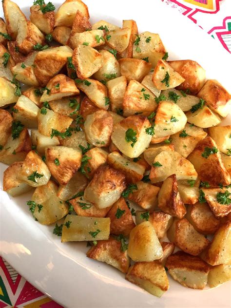 Carefully add the potatoes to the hot oil, then sprinkle over the rosemary leaves and crumble a bit of sea salt on top. Easy Oven Roasted Potatoes Recipe - Best Ever! - Melanie Cooks