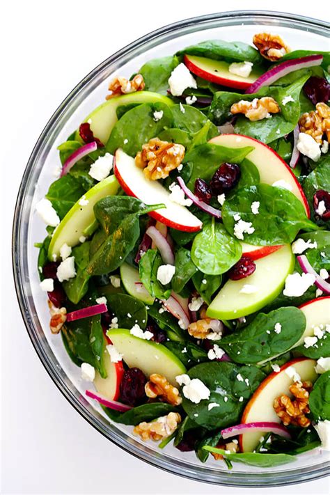 This easy spinach salad recipe is made with fresh baby spinach, crisp sweet apples, red onions, pistachios, dried cranberries, and creamy avocado, all tossed with a light homemade red wine. My Favorite Apple Spinach Salad | Gimme Some Oven