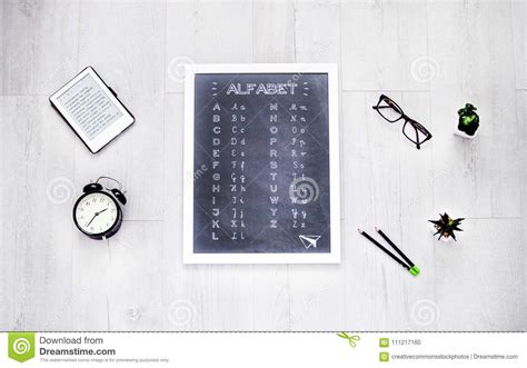 Alphabet Chalkboard At The Center Of Assorted Items Picture Image