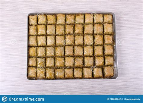 Baklava With Pistachio Walnut On A Large Table And White Striped Table