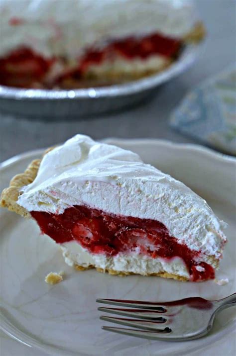 Slice Of Strawberry Pie With A Layer Of Cream Cheese And Topped With