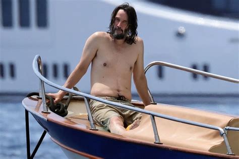 Shirtless Keanu Reeves Lounges On A Boat In Italy — See The Photos