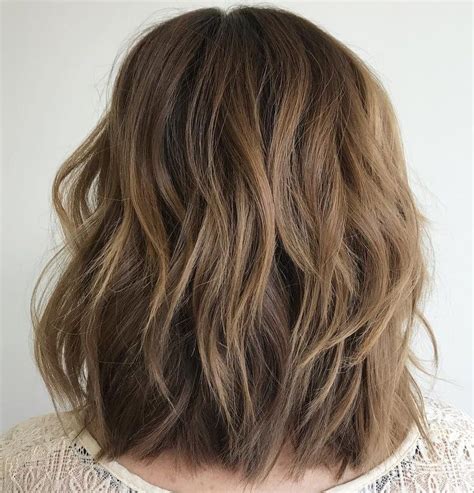 Medium hairstyle with layered bottom. Pin on Hair cut ideas