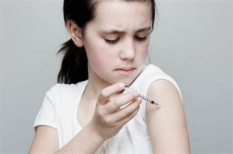 Young Girl Injecting Insulin Into Her Arm The Early Childhood Academy