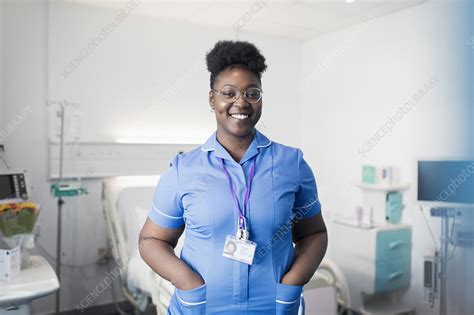 Portrait Confident Female Nurse In Hospital Room Stock Image F028