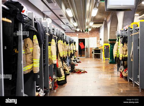 Firefighters Uniforms Hanging In Fire Station Stock Photo Alamy