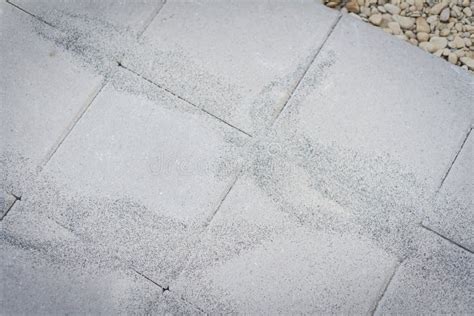 Polymeric Paver Sand On Top Of Gray Concrete Patio Stone Paver Brick