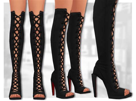 A Sexy Pair Of Lace Up Knee High Boots With A Shard Like Heel And Red