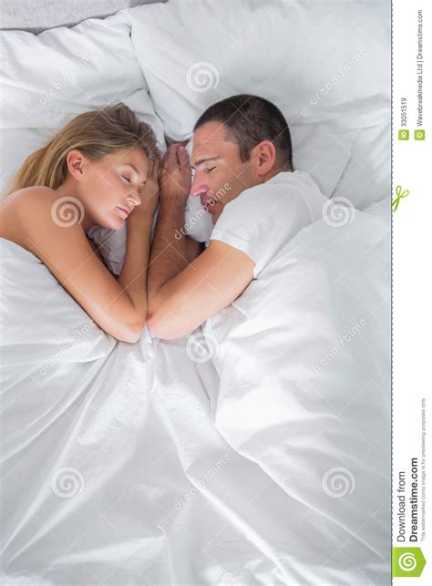 Cute Couple Lying Asleep In Bed Overhead Shot Royalty Free Stock Images