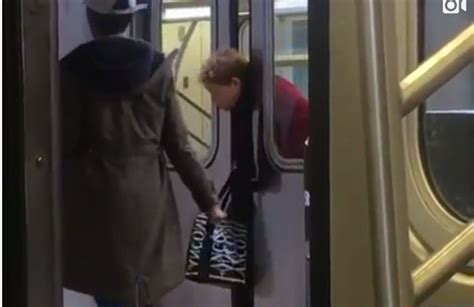 commuters ignore woman with head trapped in new york subway train doors