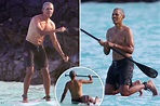 Shirtless Obama hits the waves in Hawaii... but takes a spill off his ...