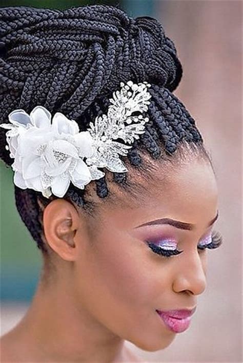 The dutch braid (also known as a reverse french) appears to be magic, as your plait seems to sit on top of your actual hair! 20 Wedding Updo Hairstyles for Black Brides - Page 2