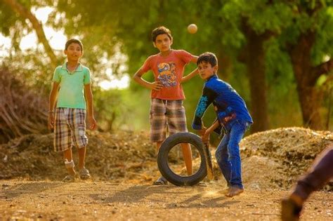 Premium Photo Rural Indian Child Playing Cricket On Ground Indian