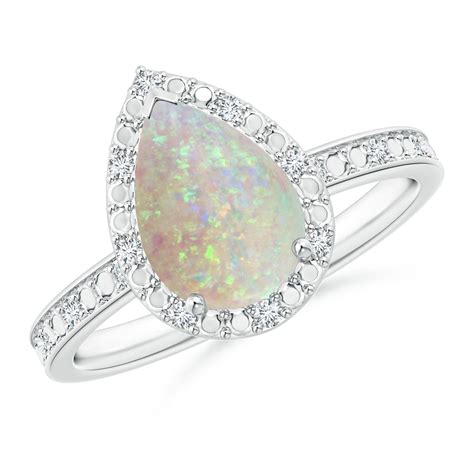 Prong Set Pear Shaped Opal Ring With Diamond Halo Angara
