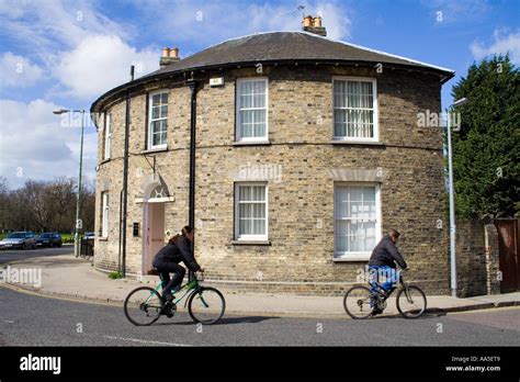 Cambridge Cyclists And Cylindrical Building Stock Photo Alamy