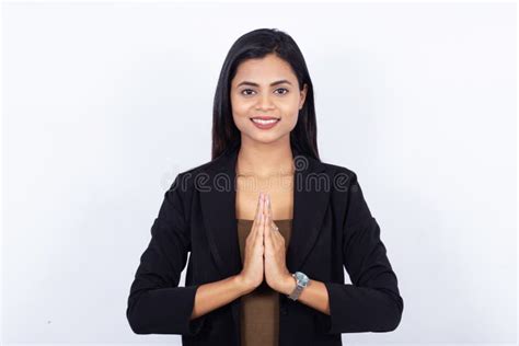Confident Young Indian Businesswoman With Finger On Lips Over White